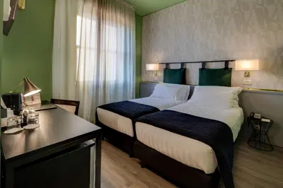 Letto o letti in una camera di Best Western Plus CHC Florence