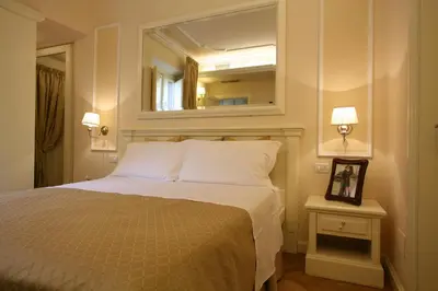 Letto o letti in una camera di Granduomo Charming Accomodation