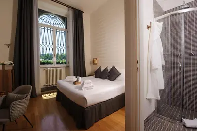 Letto o letti in una camera di Hotel Lungarno Vespucci 50