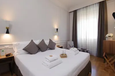 Letto o letti in una camera di Hotel Lungarno Vespucci 50