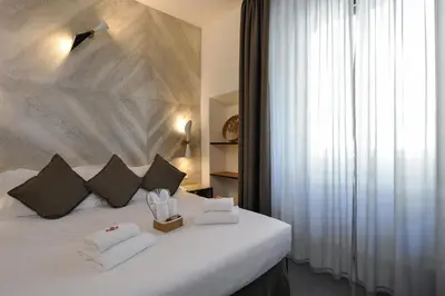 Letto o letti in una camera di Hotel Lungarno Vespucci 50