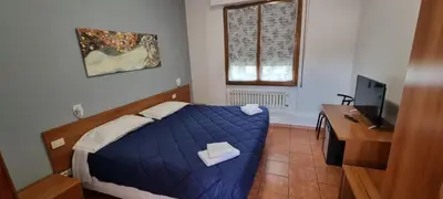 Letto o letti in una camera di Hotel Indicatore