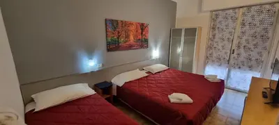 Letto o letti in una camera di Hotel Indicatore