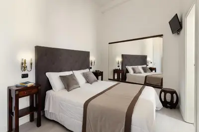 Letto o letti in una camera di Hotel Berna