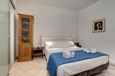 Letto o letti in una camera di Zalinda Apartment by Mamo Florence