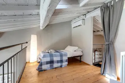 Letto o letti in una camera di Zita Apartment by Mamo Florence