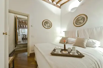 Letto o letti in una camera di Buonarroti big apartment with terrace in Oltrarno