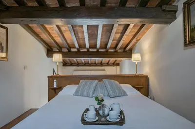 Letto o letti in una camera di Tiziano big penthouse in the Oltrarno