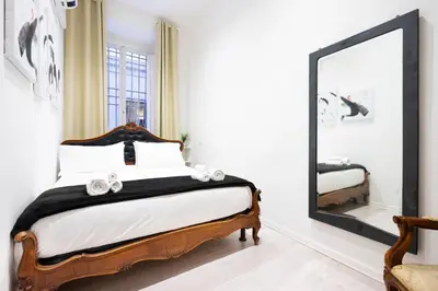 Letto o letti in una camera di Appartamento PONTE VECCHIO con POSTO AUTO su richiesta