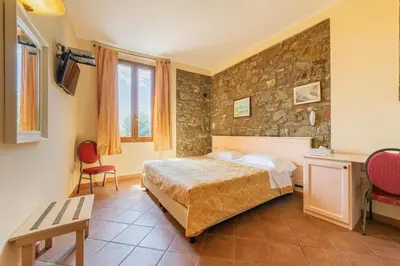 Letto o letti in una camera di Locanda Il Gallo