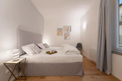 Letto o letti in una camera di Accademia - Flo Apartments