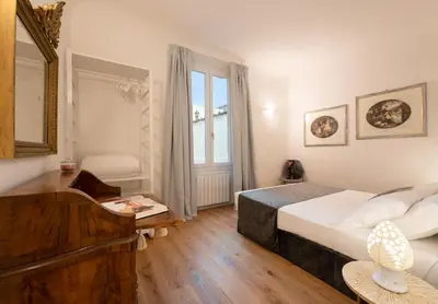 Letto o letti in una camera di Accademia - Flo Apartments