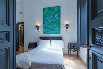 Letto o letti in una camera di Cavour 83 Prestige House by 360Rentals