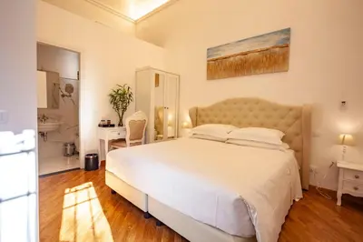 Letto o letti in una camera di Villa Royal B&B