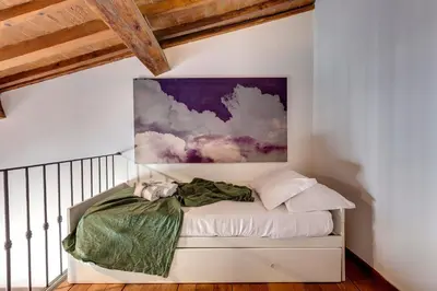 Letto o letti in una camera di Gastone Apartment by Mamo Florence