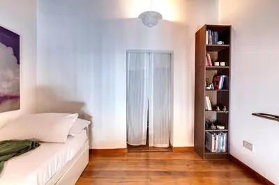 Letto o letti in una camera di Gastone Apartment by Mamo Florence
