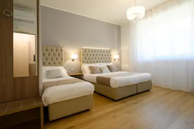 Letto o letti in una camera di Domus Uffizi