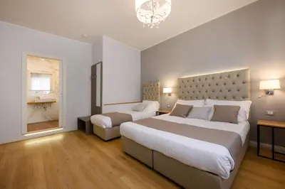 Letto o letti in una camera di Domus Uffizi