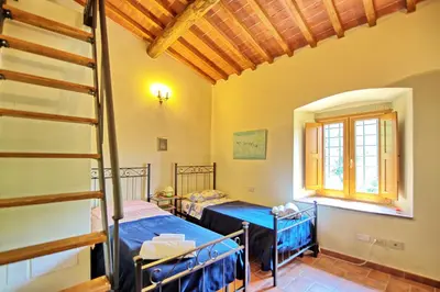 Letto o letti in una camera di Villa Poggio Conca by PosarelliVillas