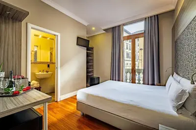 Letto o letti in una camera di B&B Residenza le Fonticine