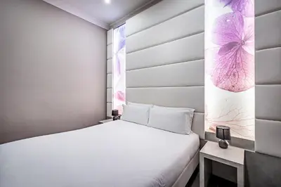 Letto o letti in una camera di B&B Residenza le Fonticine