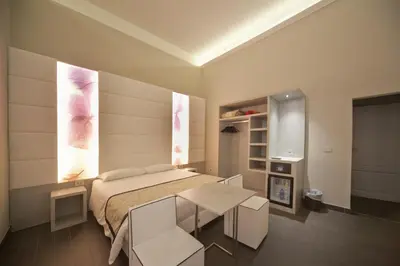 Letto o letti in una camera di B&B Residenza le Fonticine