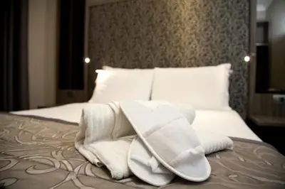 Letto o letti in una camera di B&B Residenza le Fonticine
