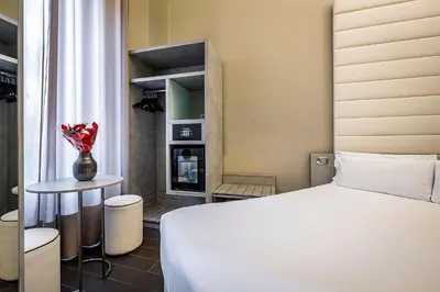 Letto o letti in una camera di B&B Residenza le Fonticine