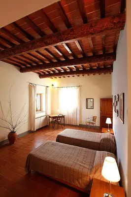 Letto o letti in una camera di Corzano e Paterno