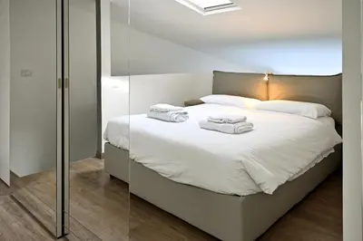 Letto o letti in una camera di Boutique Apartment “Diviso Due”