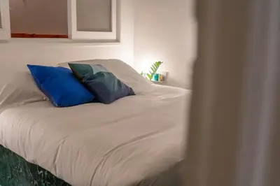Letto o letti in una camera di Memory Atelier - apartment in Florence