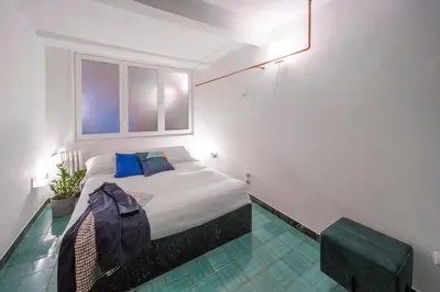 Letto o letti in una camera di Memory Atelier - apartment in Florence