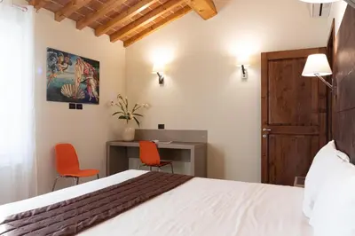 Letto o letti in una camera di Villa Carobbi Apartments Florence