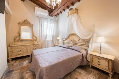 Letto o letti in una camera di Casa Griselda by Mmega