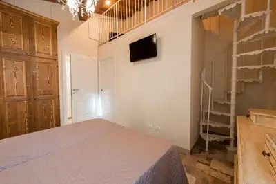Letto o letti in una camera di Casa Griselda by Mmega