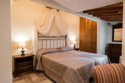 Letto o letti in una camera di Casa Griselda by Mmega