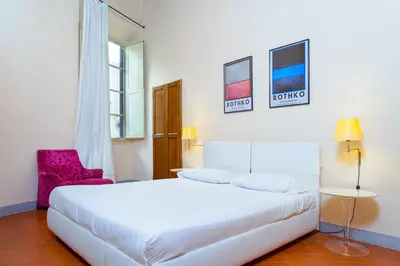 Letto o letti in una camera di Elegant Apartment Near Piazza Della Signoria