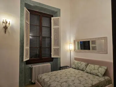 Letto o letti in una camera di Scuderie Il Magnifico
