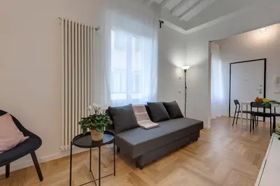 Area soggiorno di Guya Apartment by Mamo Florence