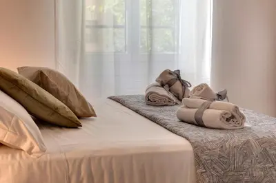 Letto o letti in una camera di Guya Apartment by Mamo Florence