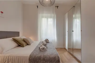 Letto o letti in una camera di Guya Apartment by Mamo Florence