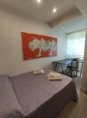 Letto o letti in una camera di Appartamento incantevole con parcheggio gratuito
