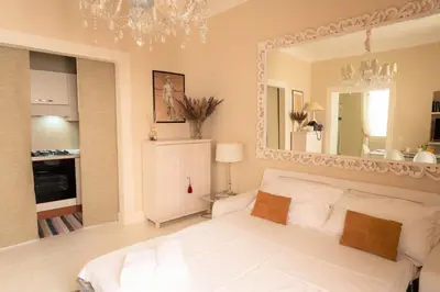 Letto o letti in una camera di White Florence Suite