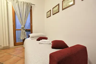 Letto o letti in una camera di Wine Apartments Florence Dolcetto