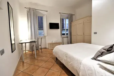 Letto o letti in una camera di Wine Apartments Florence Dolcetto