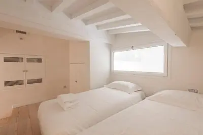 Letto o letti in una camera di Le Grazie Luxury Apartment by Mmega
