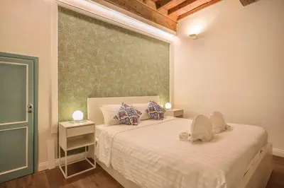 Letto o letti in una camera di Oltrarno Suite in Florence