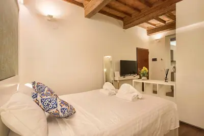 Letto o letti in una camera di Oltrarno Suite in Florence
