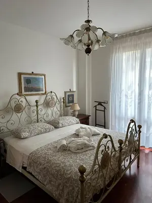 Letto o letti in una camera di Casa Maria (posto auto gratuito)