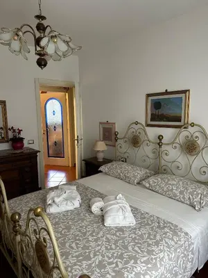 Letto o letti in una camera di Casa Maria (posto auto gratuito)
